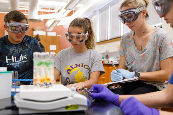 Four students in a science lab.