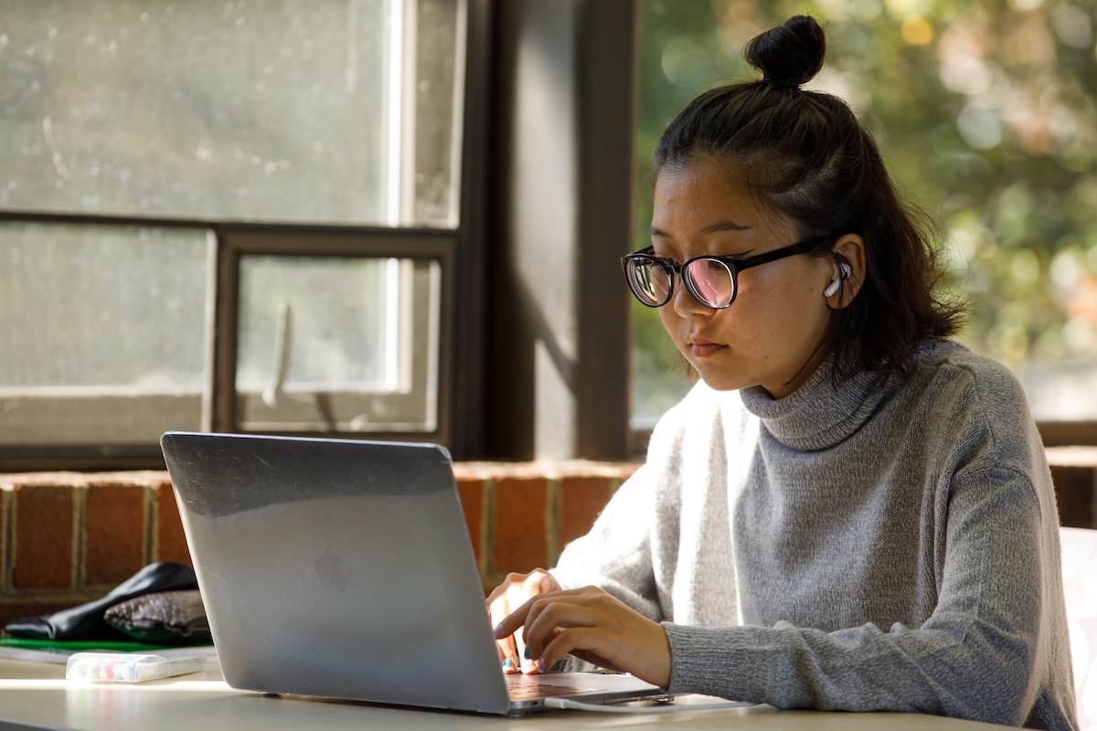 A student on a laptop.