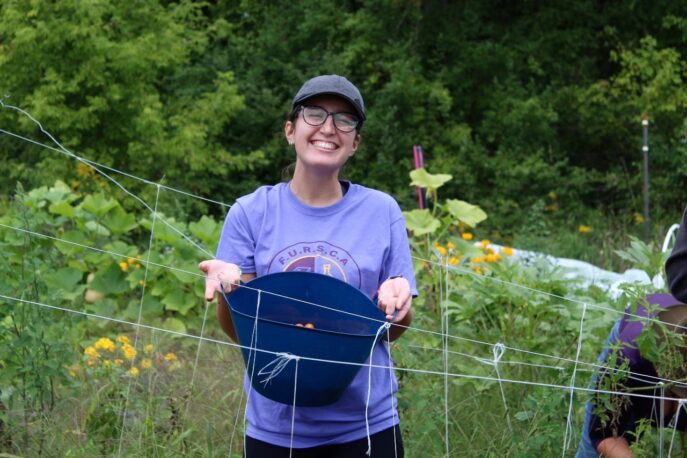 Student on Albion College Student Farm